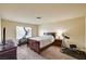 Relaxing bedroom featuring a bed and exercise equipment at 5448 Tulip Hill Ave, Las Vegas, NV 89141