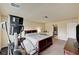 Cozy bedroom featuring a bed, television, and fitness equipment for a convenient workout space at 5448 Tulip Hill Ave, Las Vegas, NV 89141