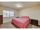 Bedroom with a window that provides natural light, and a double bed with classic bedside tables at 5448 Tulip Hill Ave, Las Vegas, NV 89141