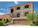 Two-story home featuring a spacious two car garage and a small balcony at 5448 Tulip Hill Ave, Las Vegas, NV 89141