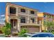 Two-story home featuring a spacious two car garage, entryway steps, and a small balcony at 5448 Tulip Hill Ave, Las Vegas, NV 89141