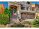 View of the entryway of the home showing the two car garage and stairway at 5448 Tulip Hill Ave, Las Vegas, NV 89141