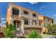 Two-story home featuring a spacious two car garage, entryway steps, and a small balcony at 5448 Tulip Hill Ave, Las Vegas, NV 89141