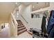 Interior entryway featuring carpeted stairs and unique shelving at 5448 Tulip Hill Ave, Las Vegas, NV 89141