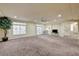 Spacious carpeted living room with recessed lighting and a ceiling fan at 5448 Tulip Hill Ave, Las Vegas, NV 89141