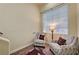 A cozy sitting room with patterned chairs and natural light at 5448 Tulip Hill Ave, Las Vegas, NV 89141