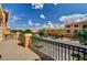 Neighborhood street view from the balcony featuring well-maintained homes, landscaping and blue sky at 5448 Tulip Hill Ave, Las Vegas, NV 89141
