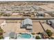 Aerial view of a home with a pool, patio, and desert landscaping at 5449 Hickory Tree St, Las Vegas, NV 89149