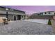 A backyard with a patio and tennis court, offering a perfect space for outdoor activities at 5449 Hickory Tree St, Las Vegas, NV 89149