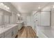 Bathroom with double sink vanity, modern fixtures, and walk-in shower at 5449 Hickory Tree St, Las Vegas, NV 89149