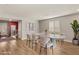 Modern dining room featuring a light wood floor, stylish table, and neutral decor at 5449 Hickory Tree St, Las Vegas, NV 89149