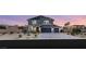 Beautiful two-story home featuring a well-manicured front yard and a two-car garage at 5449 Hickory Tree St, Las Vegas, NV 89149