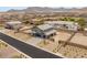 Aerial view of a two story home with a three car garage and neutral desert landscaping at 5449 Hickory Tree St, Las Vegas, NV 89149