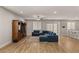 Inviting living area featuring a plush sectional, entertainment center, and a ceiling fan for added comfort at 5449 Hickory Tree St, Las Vegas, NV 89149
