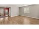Bright living room with wood floors, a large window, and an open layout for versatile furniture arrangements at 5449 Hickory Tree St, Las Vegas, NV 89149