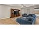 Comfortable living room with a large sectional, entertainment center, and a cozy rug at 5449 Hickory Tree St, Las Vegas, NV 89149