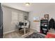 Functional home office with a desk, shelving, and comfortable seating at 5449 Hickory Tree St, Las Vegas, NV 89149