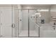 Modern walk-in shower with glass door and separate tub at 5449 Hickory Tree St, Las Vegas, NV 89149