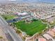 A picturesque park in a residential area with green lawns, play areas, and walking paths at 556 Decidedly St, Henderson, NV 89015