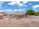 Spacious backyard with desert landscaping and covered patio at 556 Decidedly St, Henderson, NV 89015