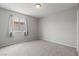 Bedroom with light gray walls, carpet, a window with coverings and neutral paint at 556 Decidedly St, Henderson, NV 89015