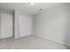 A cozy bedroom includes neutral carpeting, a closet, and white doors, providing a simple and functional space at 556 Decidedly St, Henderson, NV 89015