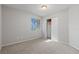 This bedroom features carpeting, a window overlooking a neighborhood, and a closet for storage at 556 Decidedly St, Henderson, NV 89015