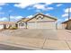 Charming home showcasing a well-maintained front yard with desert landscaping and a two-car garage at 556 Decidedly St, Henderson, NV 89015