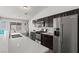 Beautiful kitchen with stainless steel appliances, granite counters, and a breakfast bar area at 556 Decidedly St, Henderson, NV 89015