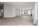 Spacious living room with wood flooring, neutral paint, and an abundance of natural light at 556 Decidedly St, Henderson, NV 89015