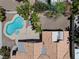 Aerial view of backyard featuring pool, spa, mature trees, and patio area at 5912 Hollowridge Rd, North Las Vegas, NV 89031