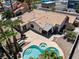 Aerial view of home featuring pool, spa, palm trees, and large backyard at 5912 Hollowridge Rd, North Las Vegas, NV 89031