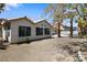 Spacious backyard area featuring a neutral tone facade home, ready for personalization and outdoor enjoyment at 5912 Hollowridge Rd, North Las Vegas, NV 89031