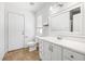 Bright bathroom featuring tile floors, white vanity, and natural light at 5912 Hollowridge Rd, North Las Vegas, NV 89031