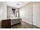 Cozy bedroom with wood-look floors, window and natural light at 5912 Hollowridge Rd, North Las Vegas, NV 89031