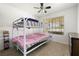 Functional bedroom with a bunk bed and window, perfect for children at 5912 Hollowridge Rd, North Las Vegas, NV 89031