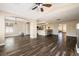 Open layout showcasing the living area, dining space, and kitchen with breakfast bar at 5912 Hollowridge Rd, North Las Vegas, NV 89031