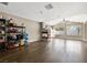 Open living room showcasing a modern fireplace, wood floors, and ample natural light at 5912 Hollowridge Rd, North Las Vegas, NV 89031