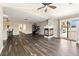Bright open-concept living room featuring a fireplace and sliding doors to the backyard at 5912 Hollowridge Rd, North Las Vegas, NV 89031
