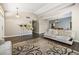 Open concept living area with sleek hardwood floors and a calming neutral palette at 5912 Hollowridge Rd, North Las Vegas, NV 89031