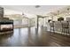 Bright, open living space featuring a stone fireplace and modern kitchen bar seating at 5912 Hollowridge Rd, North Las Vegas, NV 89031