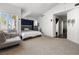 Bright main bedroom with a sitting area and an ensuite bathroom at 5912 Hollowridge Rd, North Las Vegas, NV 89031