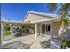 Enjoy outdoor living on the covered patio, overlooking the spacious backyard at 6021 Winter Meadow St, Las Vegas, NV 89130