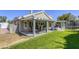Spacious backyard features a covered patio, lush grass, and a trampoline at 6021 Winter Meadow St, Las Vegas, NV 89130