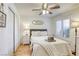 Bright bedroom features light walls, shuttered windows, and ceiling fan at 6021 Winter Meadow St, Las Vegas, NV 89130