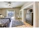 Spacious bedroom with two beds, ceiling fan, sliding door access, and ample closet space at 6021 Winter Meadow St, Las Vegas, NV 89130