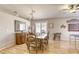 Inviting dining room with a dining table for eight, stylish decor, and views of other living spaces at 6021 Winter Meadow St, Las Vegas, NV 89130