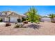 Home featuring low-maintenance desert landscaping in the front yard at 6021 Winter Meadow St, Las Vegas, NV 89130