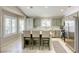 Bright kitchen with a center island, stainless steel appliances, and plenty of natural light from windows at 6021 Winter Meadow St, Las Vegas, NV 89130