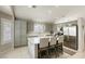 Modern kitchen featuring a center island, stainless steel appliances and tiled floors at 6021 Winter Meadow St, Las Vegas, NV 89130